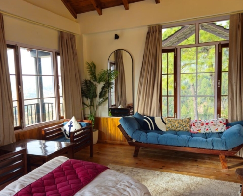 mountain-view-cottage-mukteshwar-05 Cottage bedroom and seating area in Mukteshwar